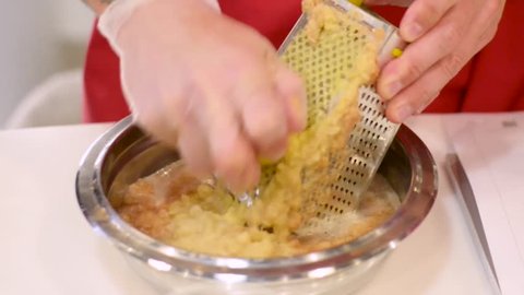 Cooking: peeled potatoes on a fine grater