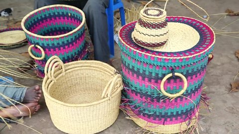 African Art. Colorful hand woven baskets on display in an art market in West Africa.