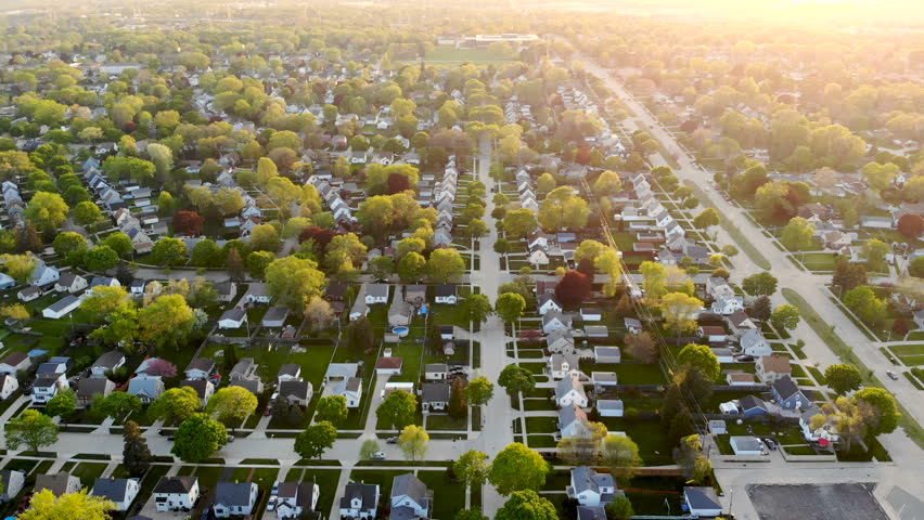Aerial view of residential houses at spring (may). American neighborhood, suburb.  Real estate, drone shots, sunset, sunlight, from above.
 Royalty-Free Stock Footage #1016048164