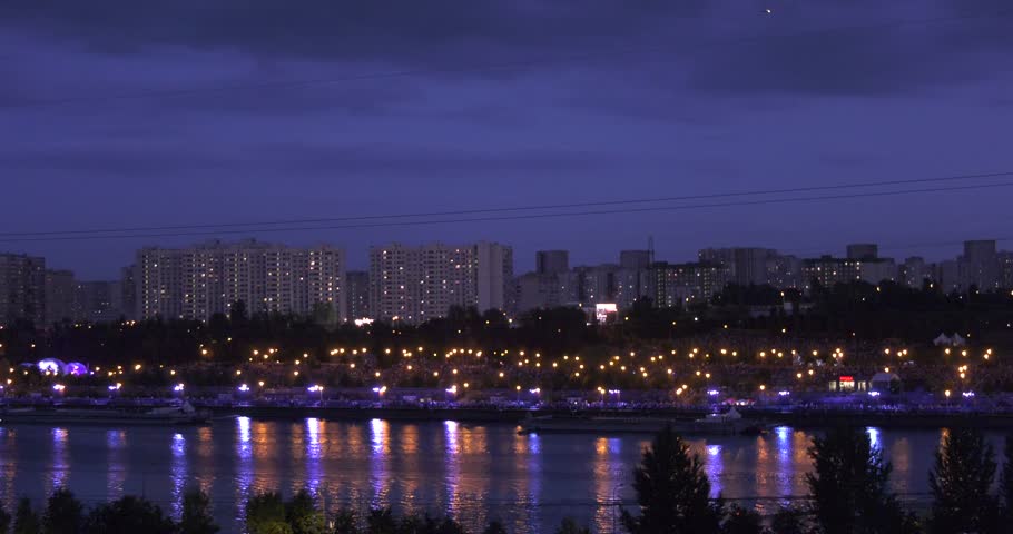 Night sky and evening city scenery on annual pyrotechnical international festival in celebrations near Moscow River in Moscow, Russia