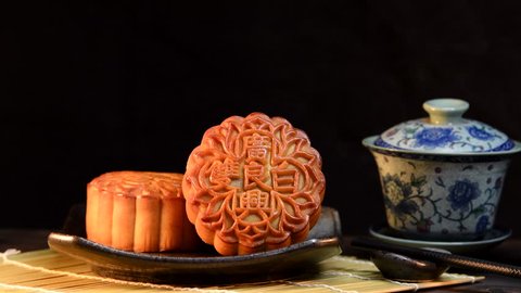 Mooncakes are offered to friends or on family gathering during the mid-autumn festival / Mooncake/ The Chinese character on the mooncake represent "Double white" in English