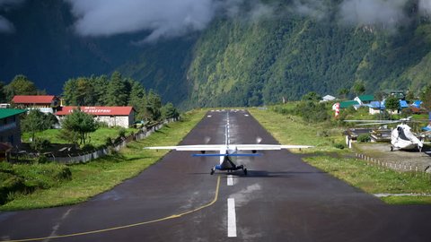 LUKLA, NEPAL - 20 SEPTEMBER 2017: Aircraft Take off and Fly to Kathmandu Followed by Helicopter on Runway at Tenzing–Hillary Airport 4K       