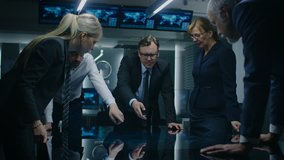 Diverse Team of Corporate Businesspeople Have Heated Discussion While Standing Around the Digital Touch Screen Table. Board of Directors of Import / Export Company Have Meeting. Shot on RED EPIC-W 8K  - Powered by Shutterstock - Get 15% off with code: PIKWIZARD15