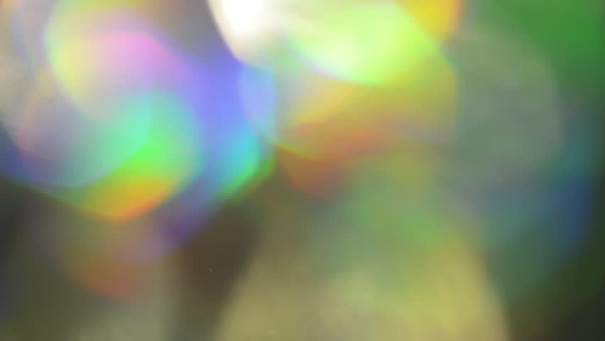 Moving Holographic Iridescent foil. Multicolor surface and shiny background. Fast speed. Royalty-Free Stock Footage #1016068231