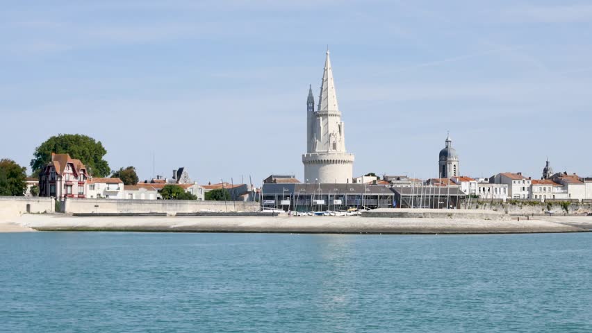 Cityscape of La Rochelle, a town in western France. The lantern tower ("Tour de la Lanterne" in french) is one of the famous towers of the old port. 