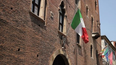 Verona, Italian Flag on ancient Palace  in Verona, Italy-July 2018