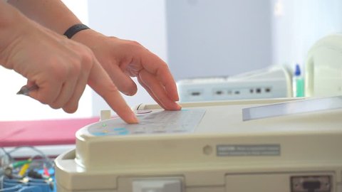 Doctor prints on the ECG  printer 