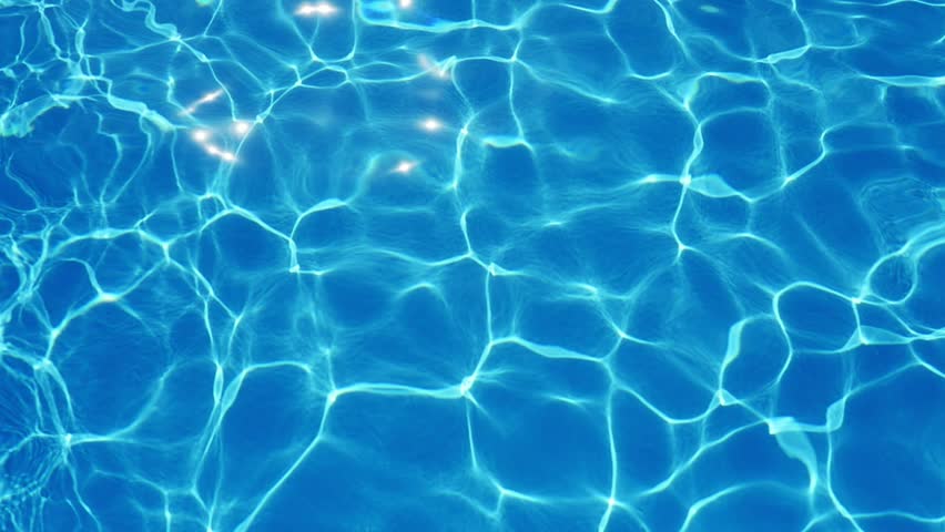 A marvelous view of sky blue waters in a swimming pool with shining web altering its shape beautifully in summer in slow motion Royalty-Free Stock Footage #1016080672