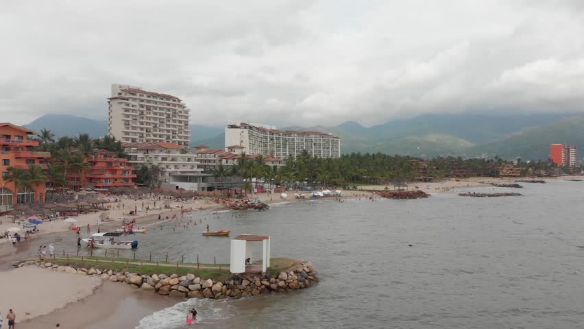 Aerial dolly zoom with panoramic view of Bahía de Banderas in Puerto Vallarta, México on a clear and sunny day.