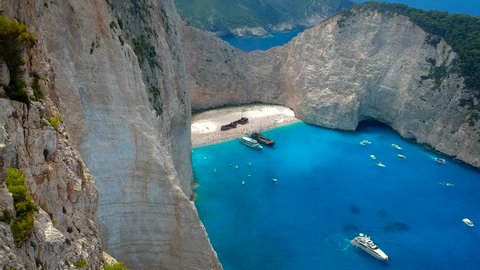 Aerial panorama reveal of Amazing Navagio Beach in Zakynthos Island with Ship Wreck beach and Navagio bay visible. The most famous natural landmark of Zakynthos, Greek island in the Ionian Sea.