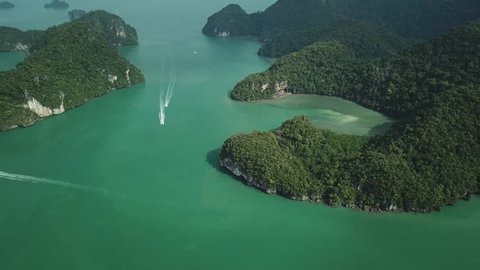 Bird’s eye view Nature landscape Dayang Bunting Island Lake Pregnant Maiden. Guillemard Rain forest Rocks Sea Green water Boats sail great speed. Langkawi Malaysia Travel Landmark Day sunny. Aerial