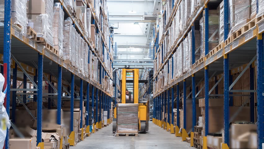 People and vehicles working in a warehouse. Industrial production concept, high working efficiency. 4K time-lapse | Shutterstock HD Video #1016100094