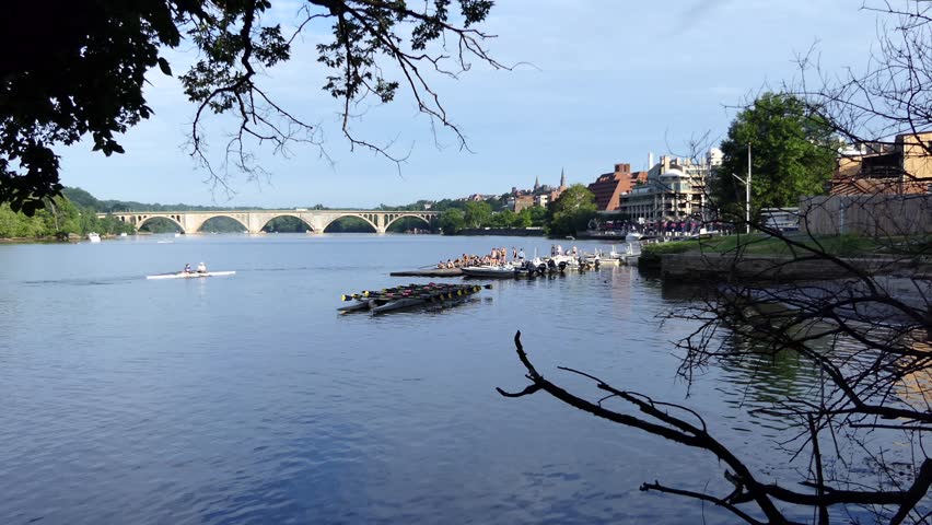
Washington DC waterfront view on Potomac River with Georgetown Waterfront park, people, buildings and Francis Scott Key Bridge.