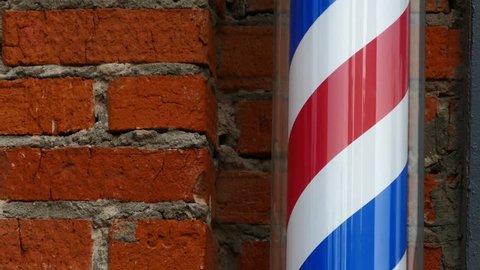 Motion Of Barbershop Pole Spinning At Barber Shop outdoors