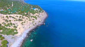 Aerial view residential exclusive relax homes Crimea Bounti Beach, coral Bay, summer, blue laguna, Black sea, sunTop view video beauty nature landscape with beach corals and sea on Crimea island