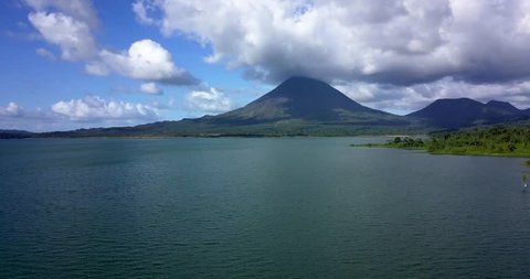 Beautiful cinematic view of the Arenal volcano and the Lagoon in Costa Rica