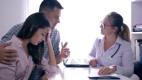 women health, female doctor consults upset family couple with problem of infertility at her medical office - Powered by Shutterstock - Get 15% off with code: PIKWIZARD15