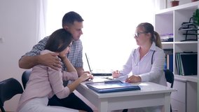 women health, gynecologist doctor talking of infertility to a young upset couple in a white medical office in a hospital - Powered by Shutterstock - Get 15% off with code: PIKWIZARD15