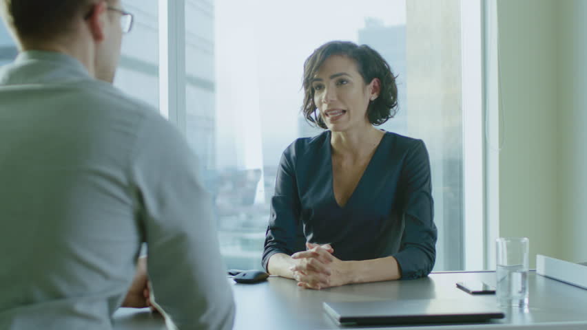 Beautiful Young Businesswoman Talks with a Potential Business Partner and Shakes Hands When them come to a Agreement. Strong Independent Woman in Business Situation. In Slow Motion.  Royalty-Free Stock Footage #1016145910