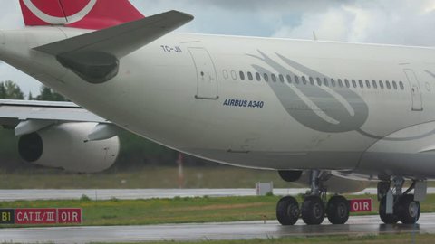Oslo Airport Norway - ca September 2018: airplane turkish airlines huge airbus a340 rear view zoom out from tail