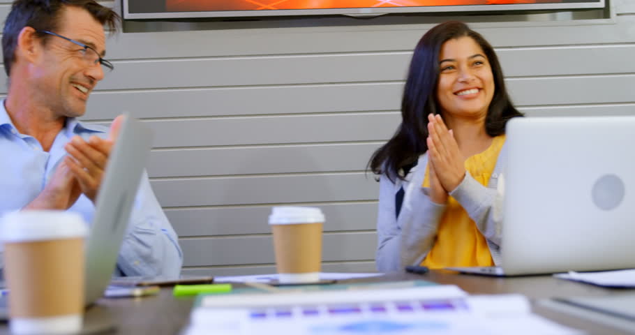 Front view close up of happy executives applauding in office 4k