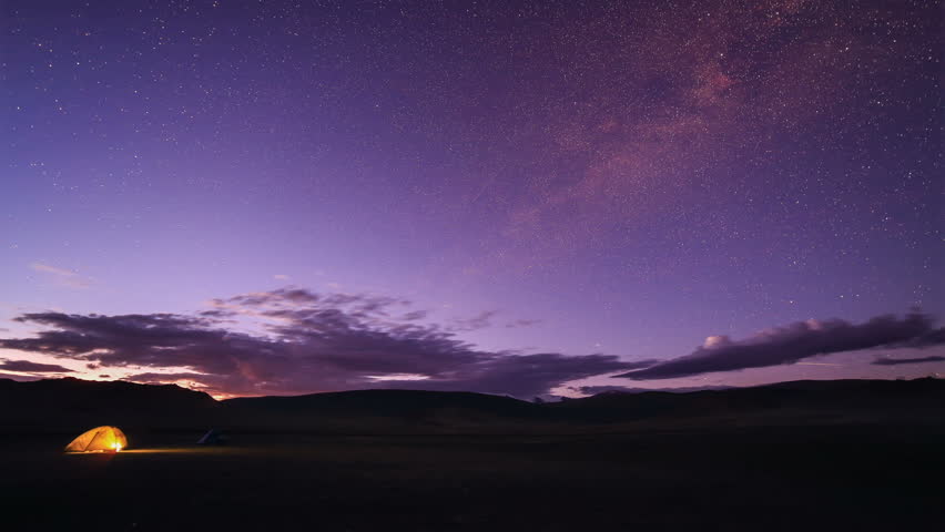 Starry Night over the clouds over the salted lake Durgun Nuur, Mongolia. Full HD