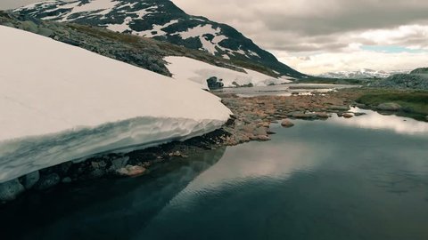 Drone video of a snowy and rocky mountain in norway europe