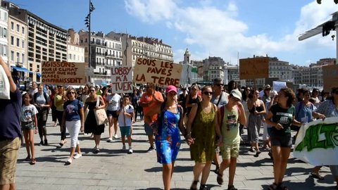 Marseille, France - September 08, 2018 : People hold banners as they take part in a march as part of a global day of action "Rise For Climate"