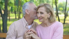 Senior man telling jokes, flirting with woman, mature love, happiness in old age - Powered by Shutterstock - Get 15% off with code: PIKWIZARD15