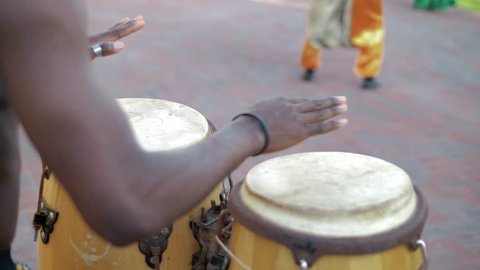 Black African plays on ethnic bamboo drums