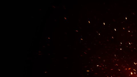 Beautiful Burning Hot Sparks Rising from Large Fire in Night Sky. Abstract Isolated Fire Glowing Particles on Black Background Flying Up. Looped 3d Animation. Moving from Corner. 4k UHD 3840x2160.