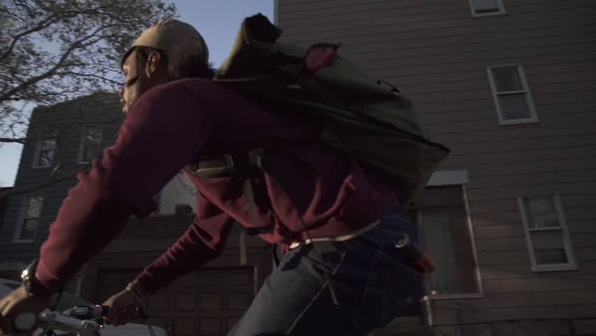 Man riding bicycle on city street