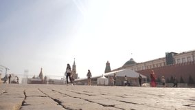 Red Square Kremlin in Moscow Russian Federation people walk on the sidewalk. slow motion video. National Landmark. Tourist Destination. Russia lifestyle travel tourism moscow main attraction