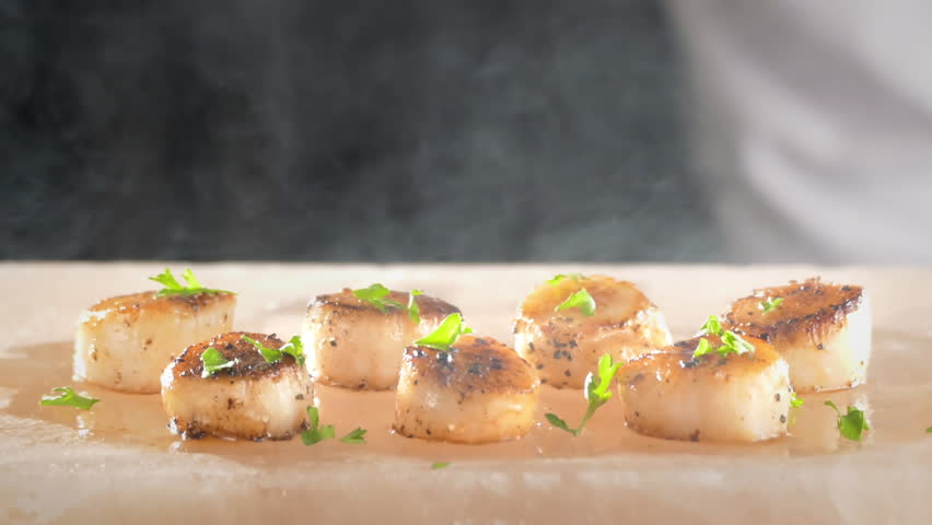 Chef preparing healthy gourmet food, seared scallops on Himalayan salt block | Shutterstock HD Video #1016214574