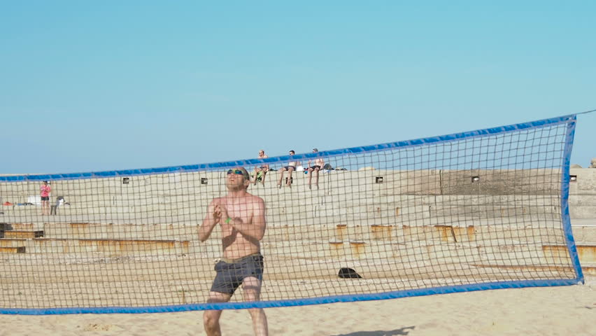 Men play volleyball on vacation. | Shutterstock HD Video #1016220547