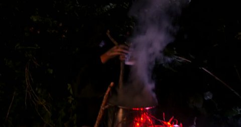 Wicked Witch stirs the potion in Halloween Horror Scene