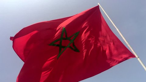 4K Moroccan waving flag on blue sky