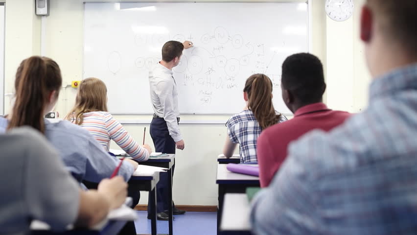 Male High School Tutor At Whiteboard Teaching Science Class | Shutterstock HD Video #1016231443