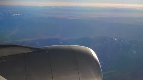 sunny day flying airplane engine passenger window view panorama 4k china