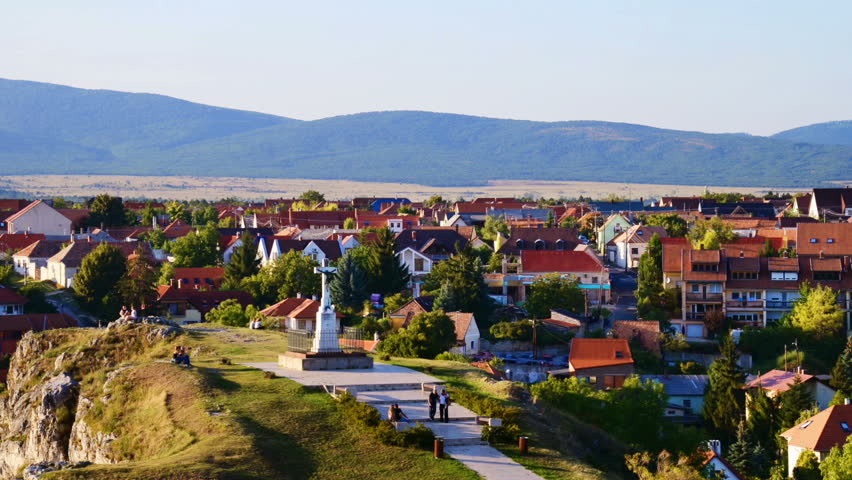 Veszprem, Hungary. Aerial view of monument from Castle hill in the evening in Veszprem, Hungary. Clear sky over the mountains. Time-lapse
