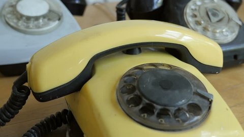 Hand dialing old antique rotary phone
