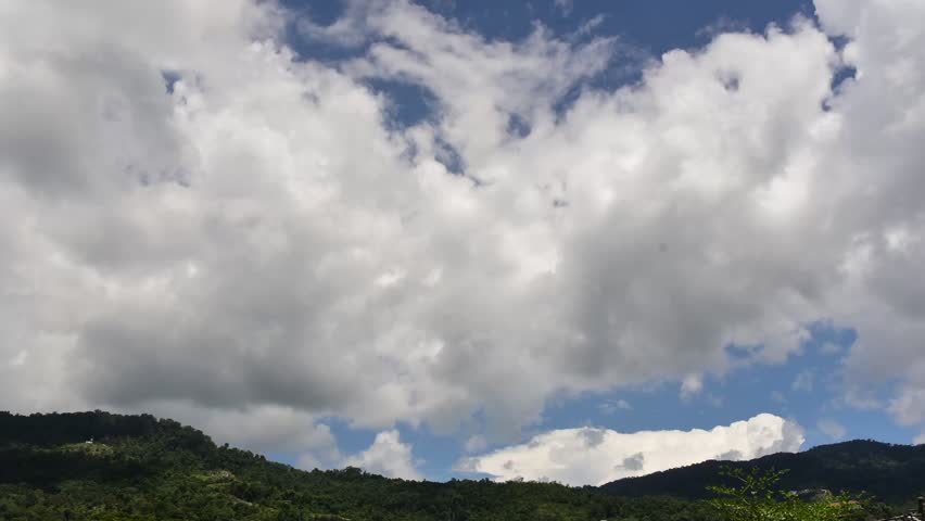 Full HD 1080p 14 seconds time lapse clip of landscape and clouds movement on a day with blue sky