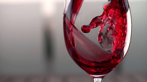 Red wine forms a beautiful wave in a glass fuse