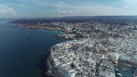 Aerial video. Old Town of Monopoli - city on Adriatic Sea. Italy. 4K