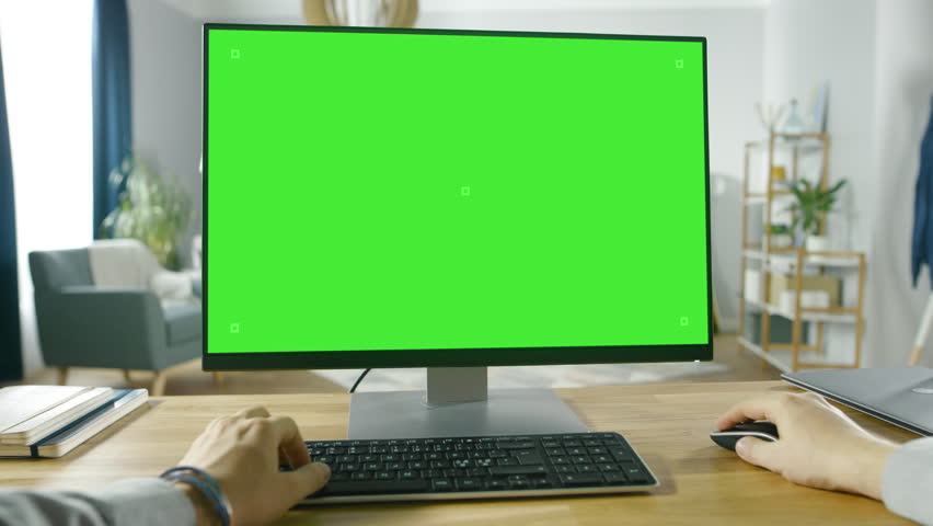 First Person View of Professional Freelancer Working on Green Mockup Screen Personal Computer From Home.  Shot on RED EPIC-W 8K Helium Cinema Camera. Royalty-Free Stock Footage #1016262025