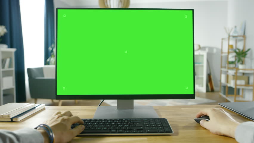 First Person View of Professional Freelancer Working on Green Mockup Screen Personal Computer From Home.  Shot on RED EPIC-W 8K Helium Cinema Camera. | Shutterstock HD Video #1016262025