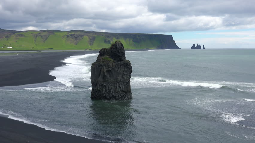 ICELAND - CIRCA 2018 - Beautiful rock formation at Dyrh?laey black sand beach, Iceland.