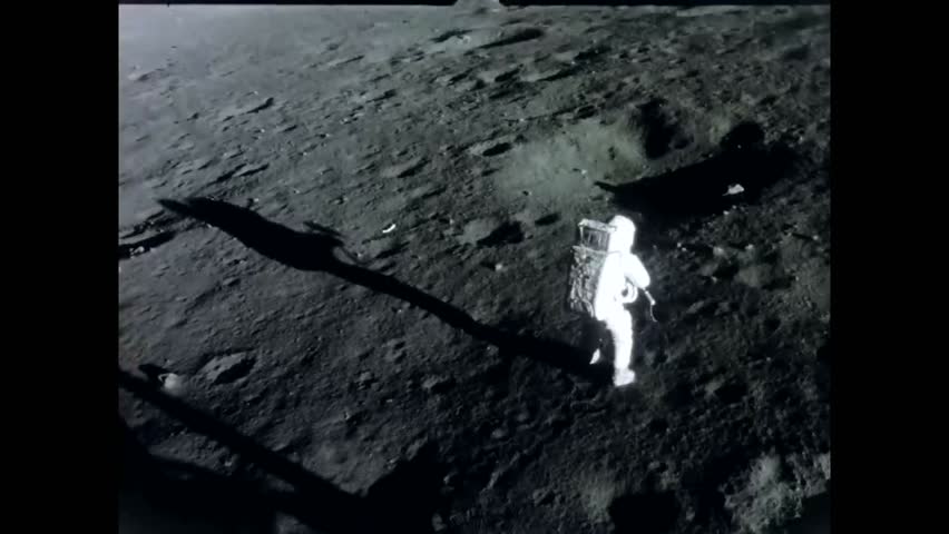 CIRCA 1969 - The Apollo 12 crew sets up base on the moon. Royalty-Free Stock Footage #1016273296