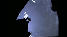 CIRCA 1972 - Apollo 17 tracks a spacecraft in lunar orbit; astronauts conduct an EVA on it. - Powered by Shutterstock - Get 15% off with code: PIKWIZARD15