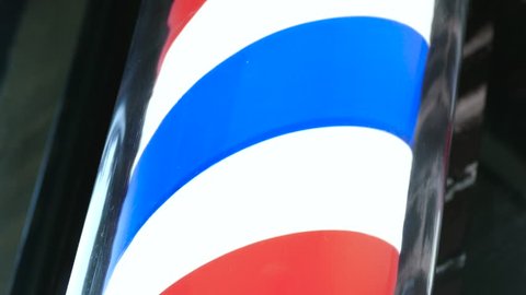 Motion Of Barbershop Pole Spinning At Barber Shop outdoors